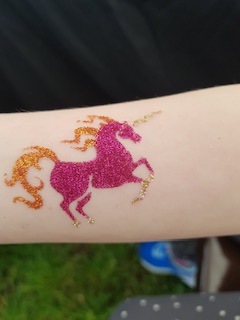 pink gliutter unicorn tattoo
